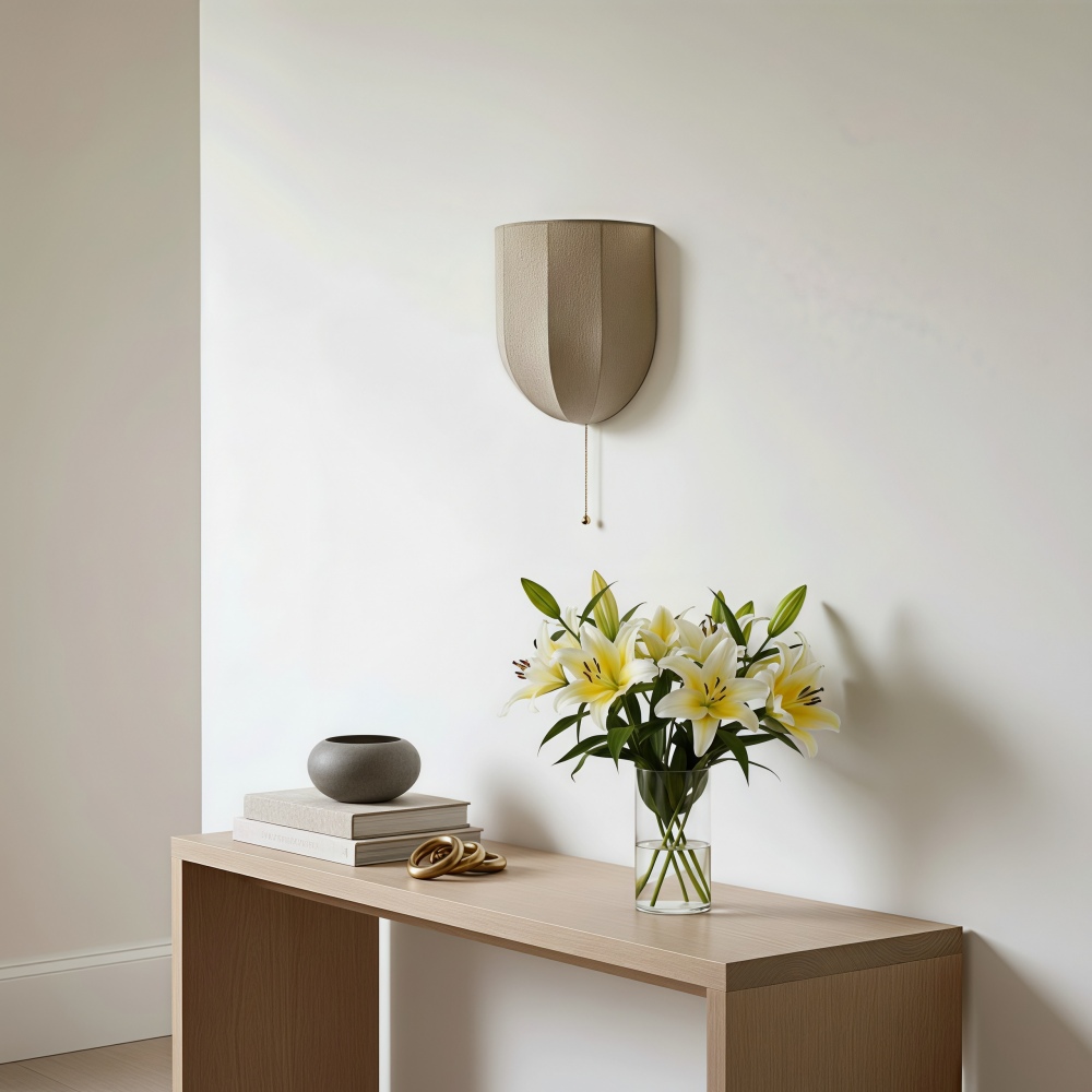 Fablune wall sconce above a console table