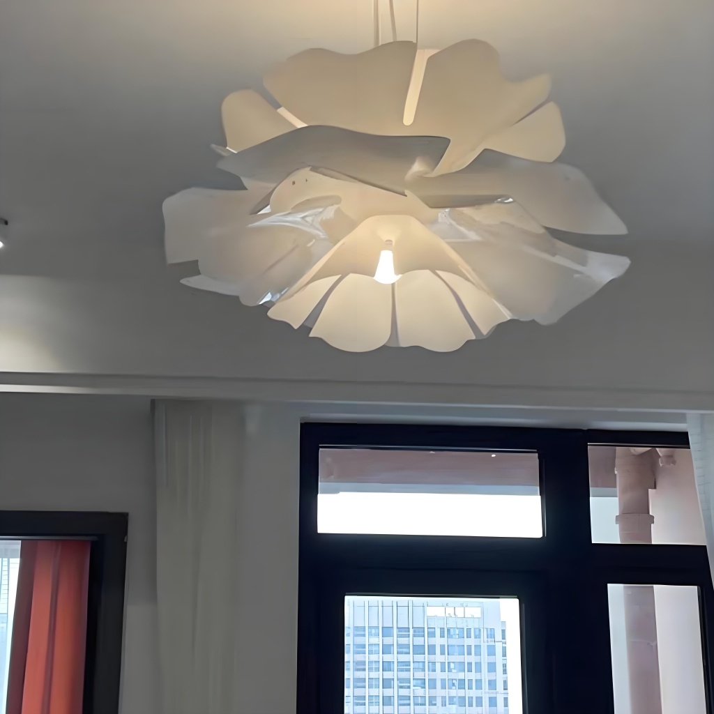 Layered pendant light glowing near a window