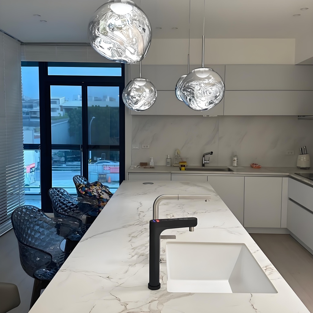 Silver Glyador pendants above kitchen island