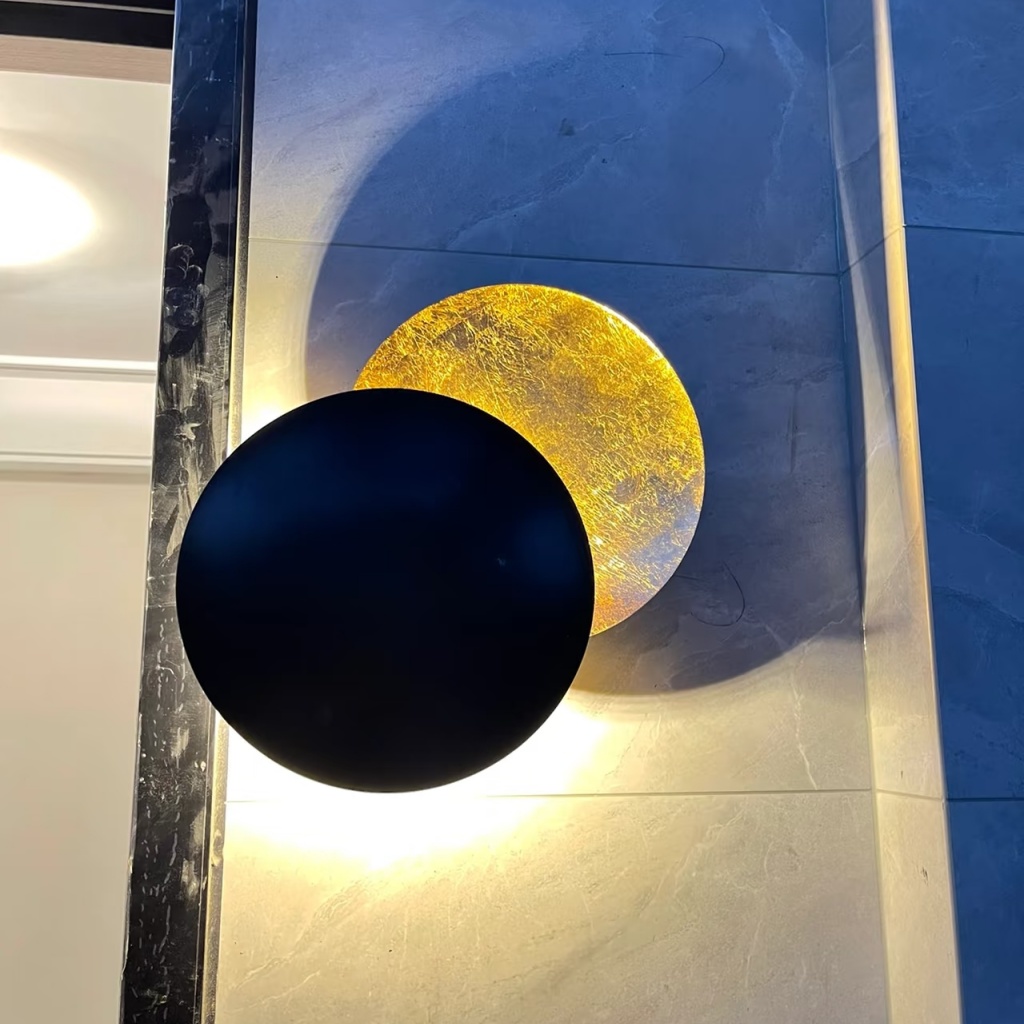 Discola wall light glowing on a wall