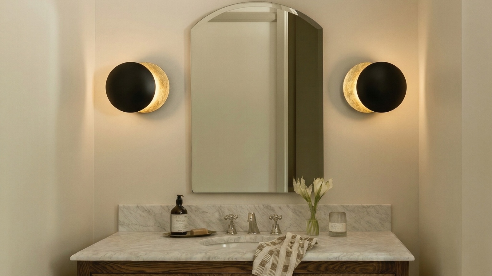 Discola wall lights installed beside a bathroom mirror