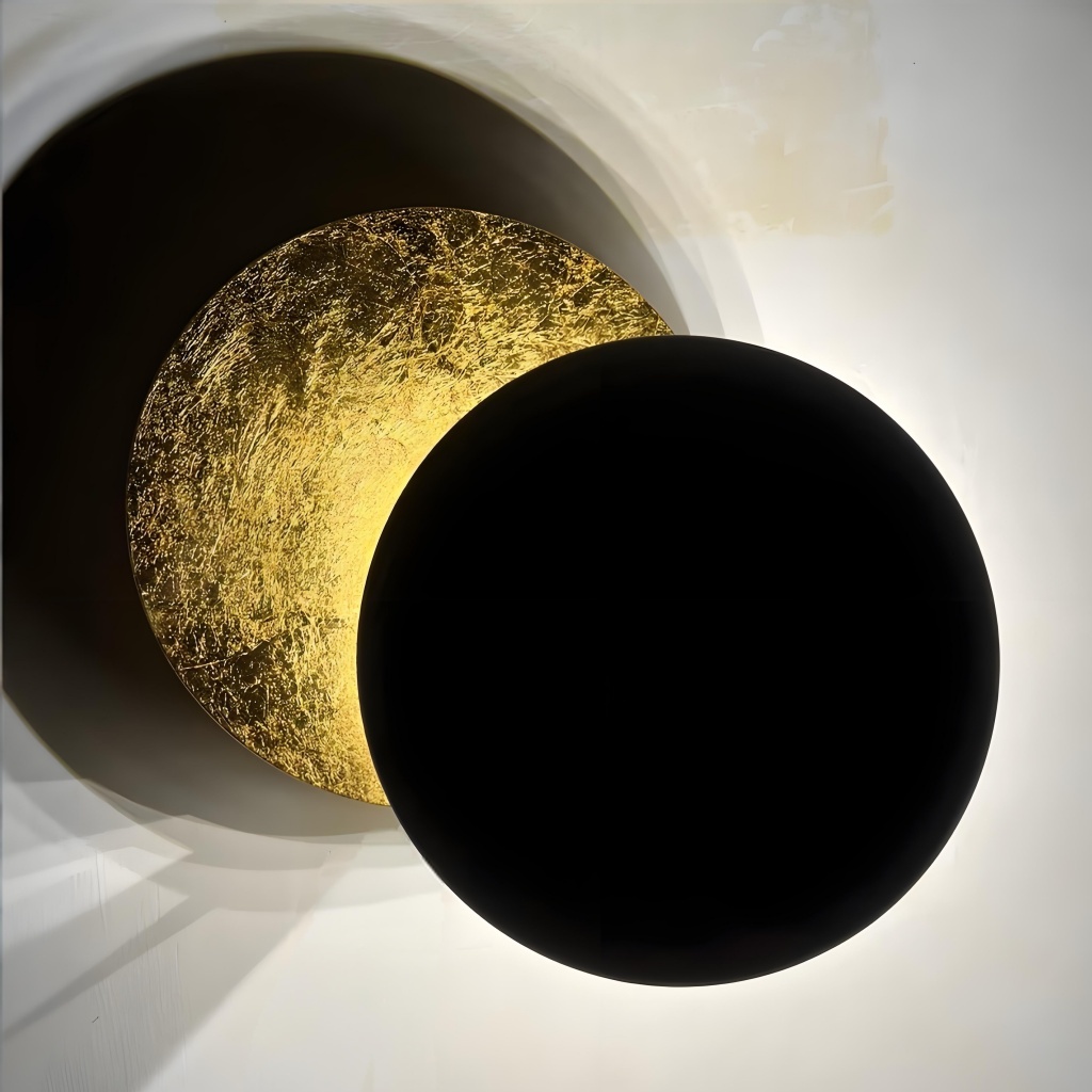Black and gold Discola wall light close up