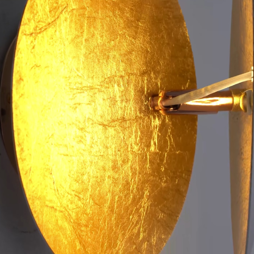 Close up of illuminated brass leaf finish