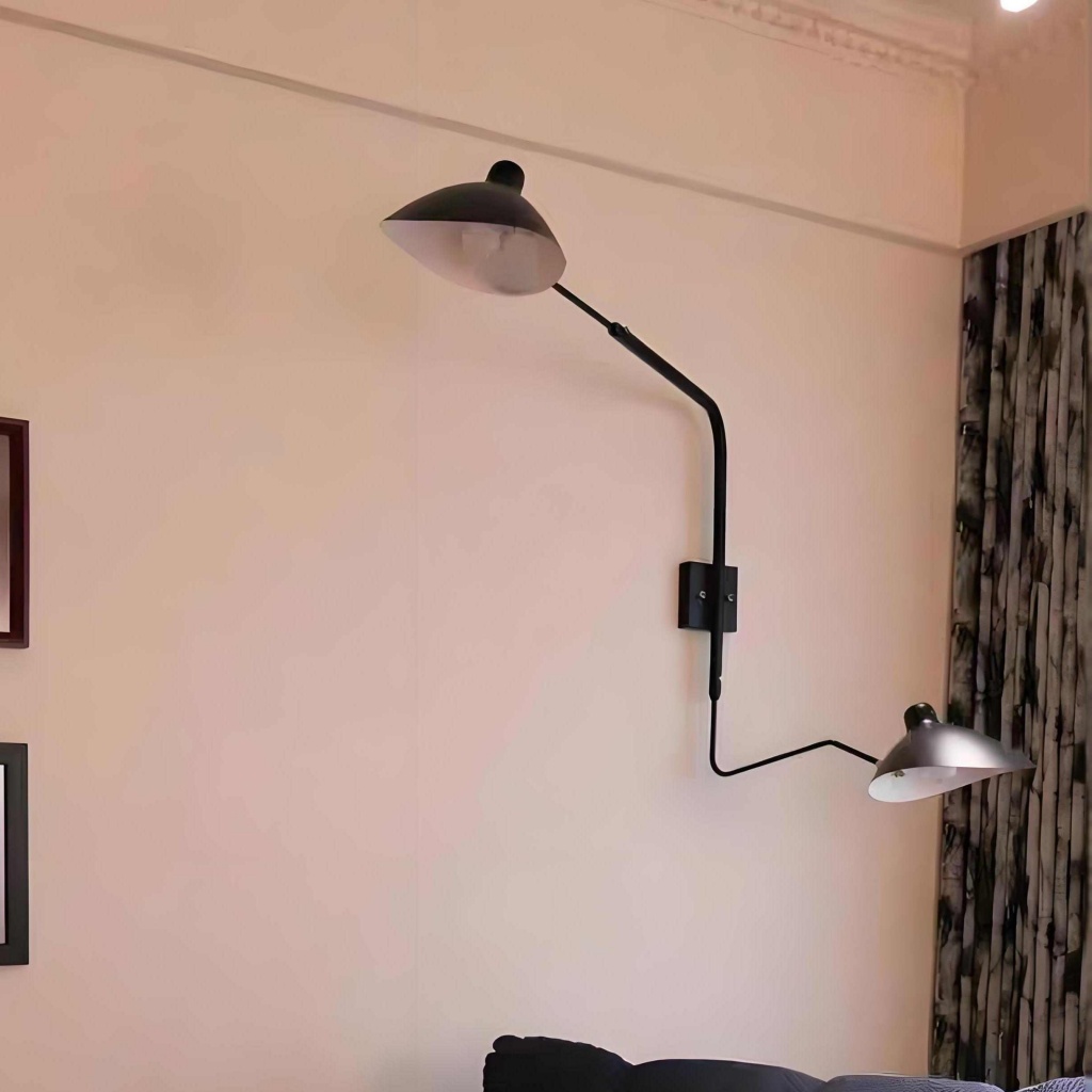 Arclume wall light in a softly lit room