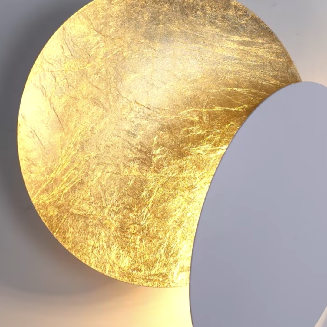 Close up of reflective brass disc edge