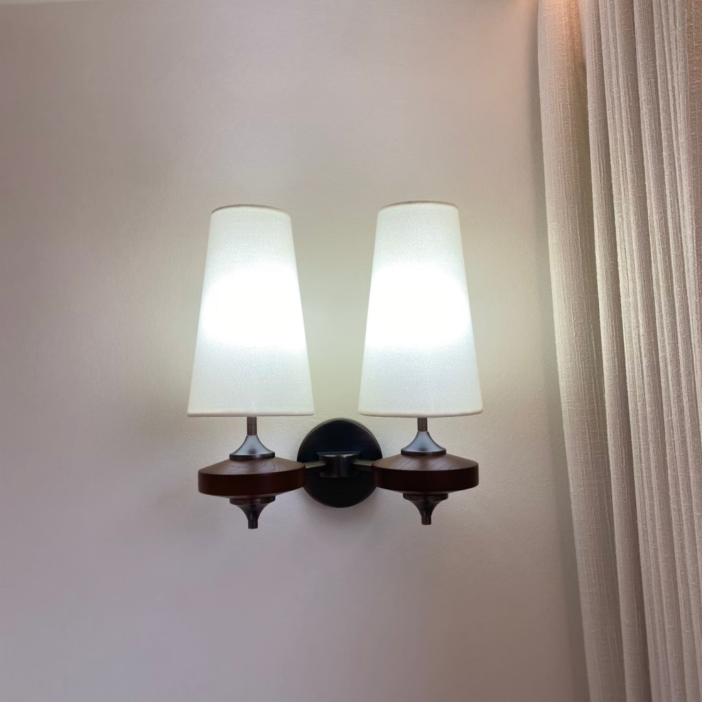 Installed white double wall lamp in a real space