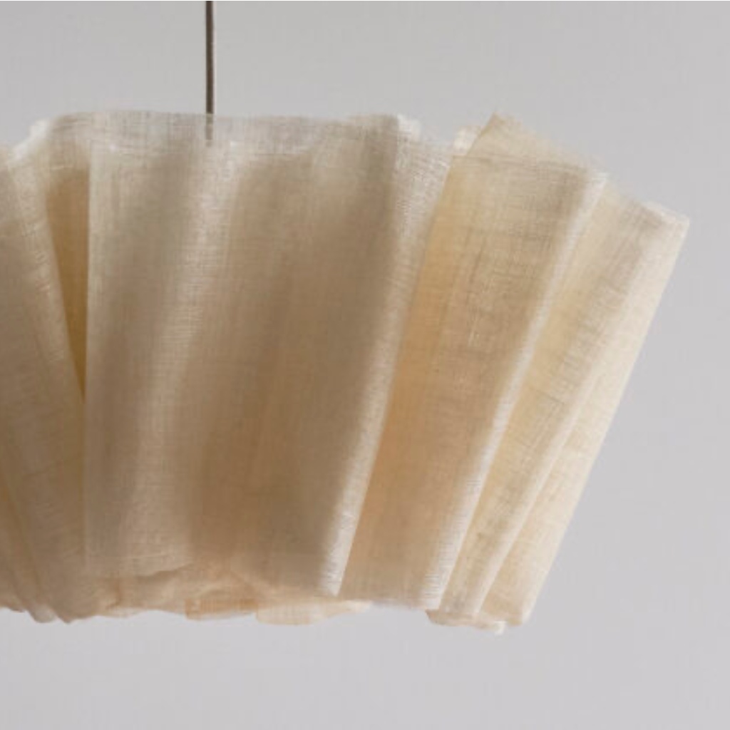 Pleated shade fabric and folded edge detail