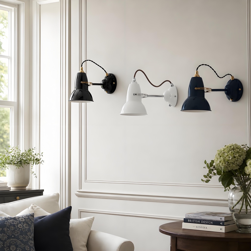 Three Modryx adjustable wall lights above a sofa