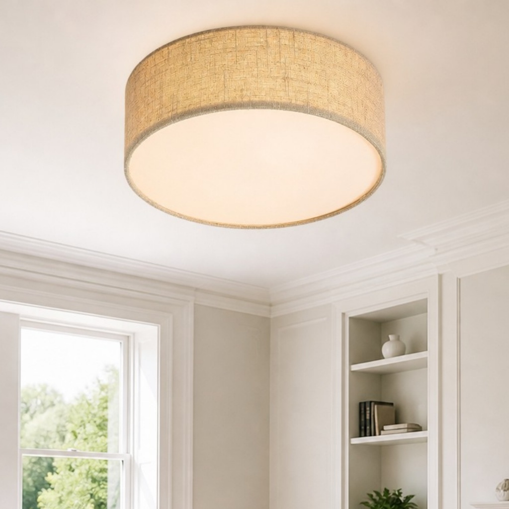 Close view of cream drum ceiling light in a bright room
