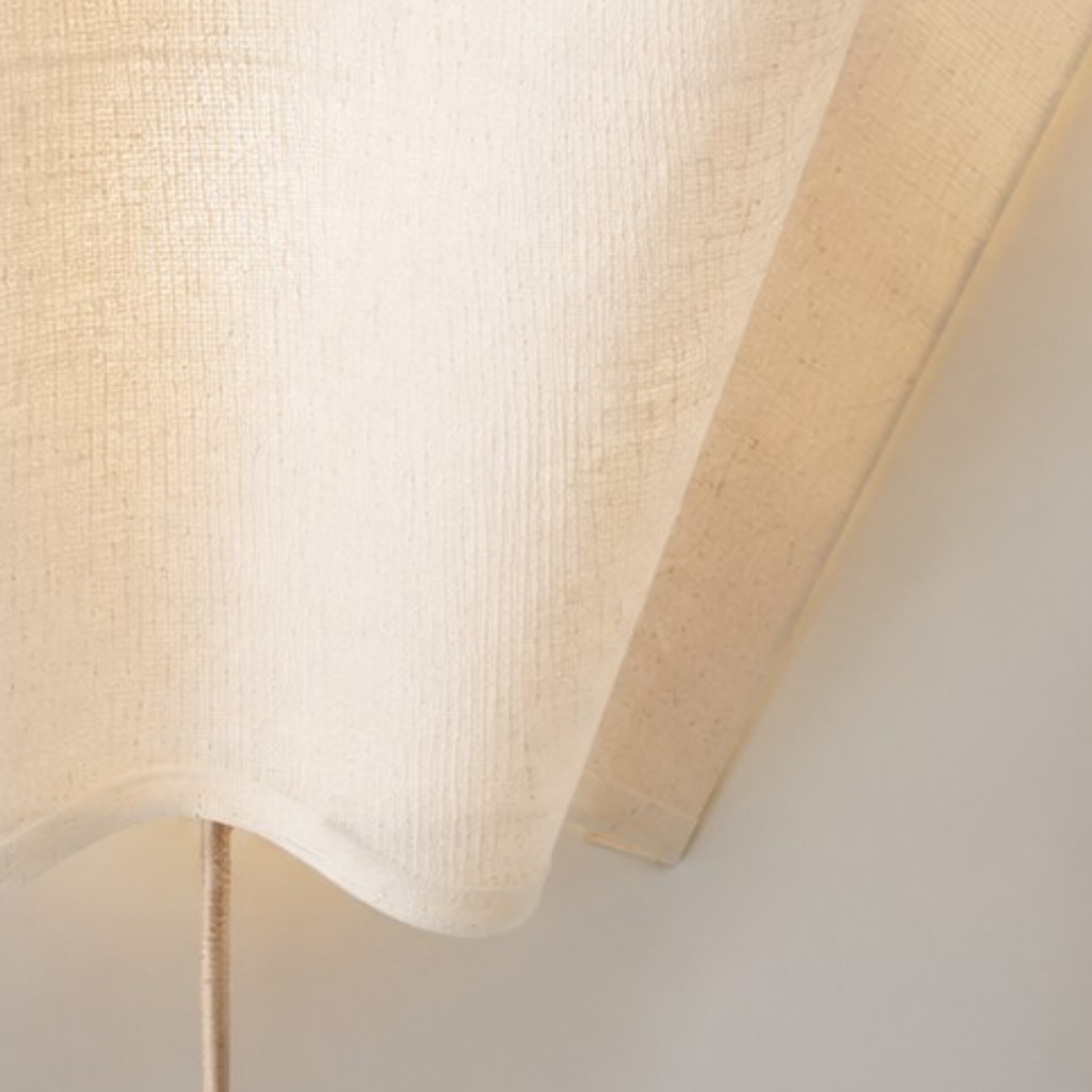 Close view of the linen shade texture and scalloped edge