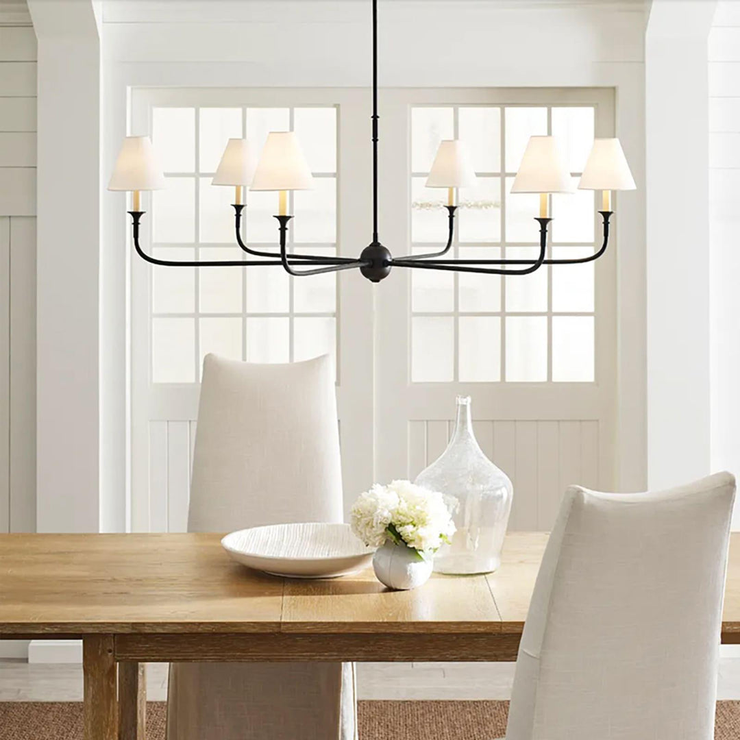 Piaf Grande chandelier over a dining table