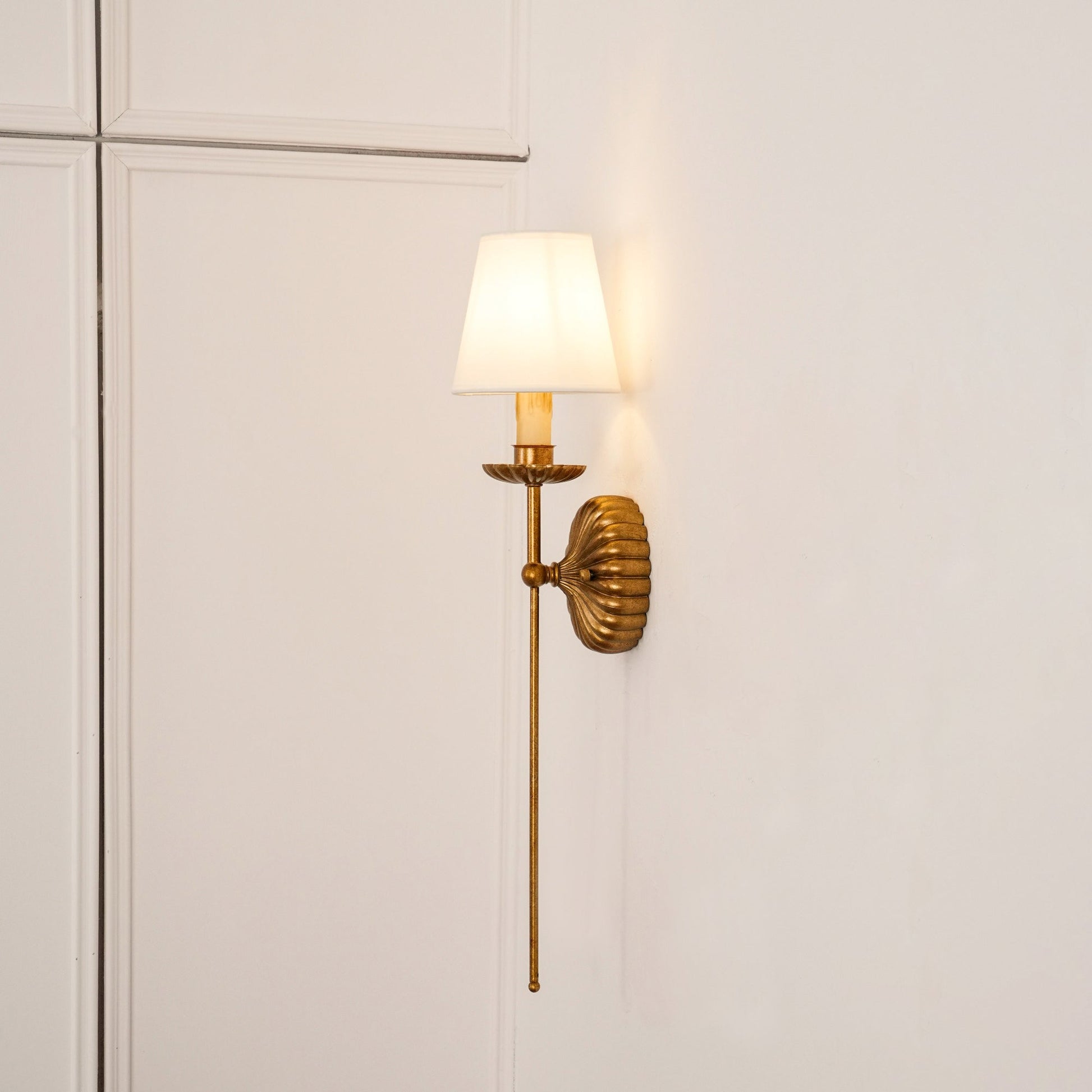 Catina wall sconce in antique gold finish