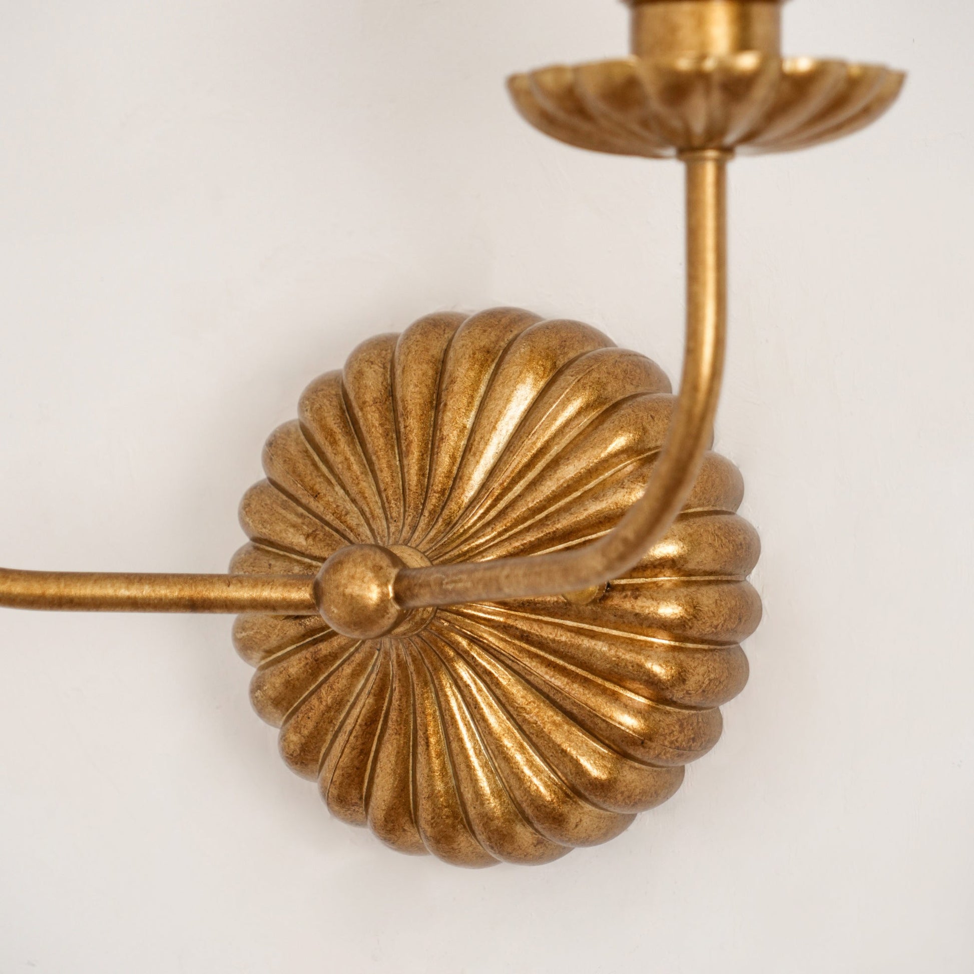 Iron body with hand-applied gold leaf detailing