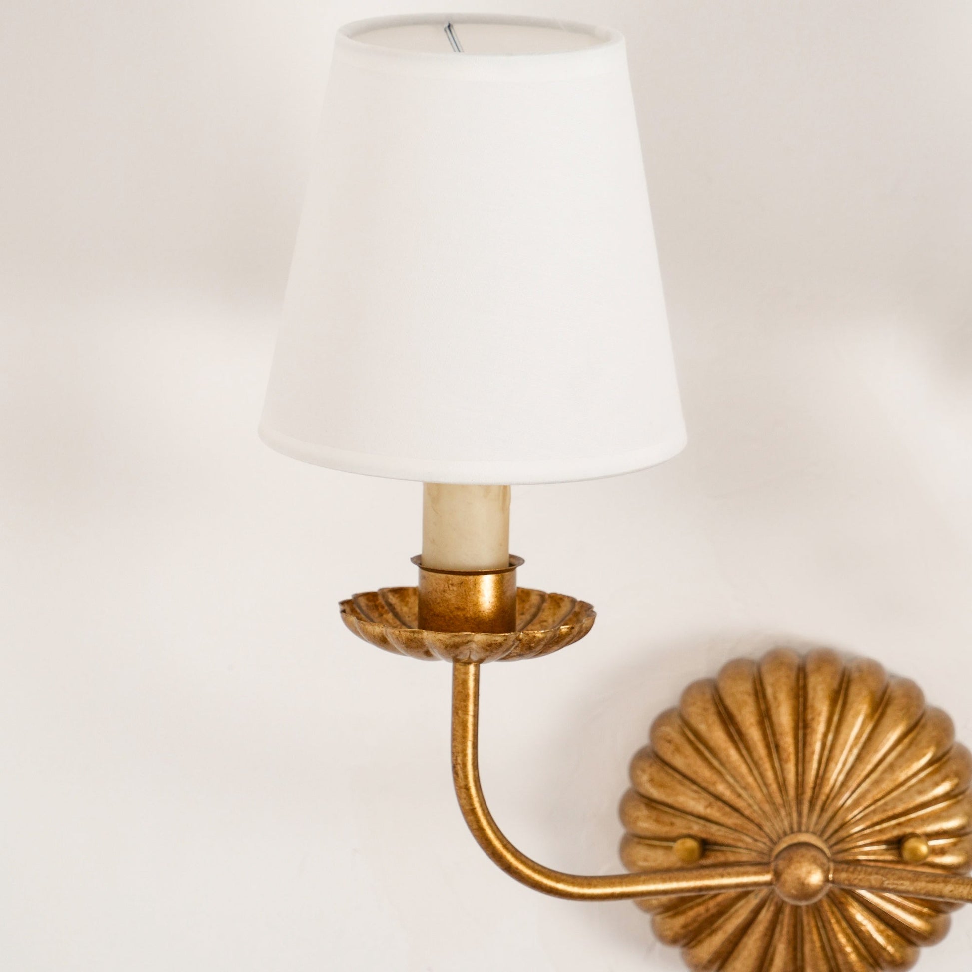 With antique gold candlesticks