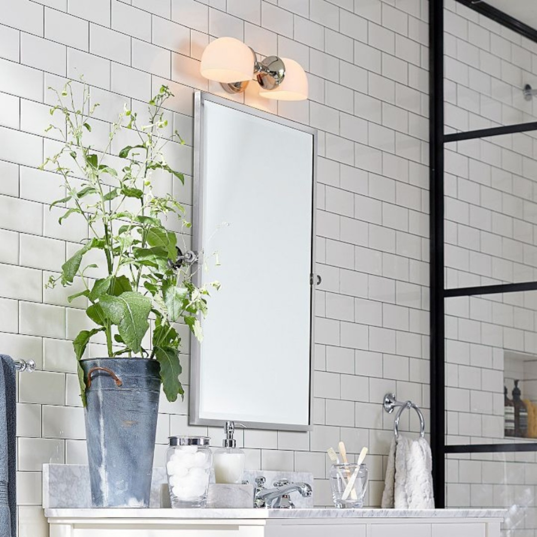 Modern Mercer Double Horizontal Metal Wall Sconce installed above a bathroom mirror