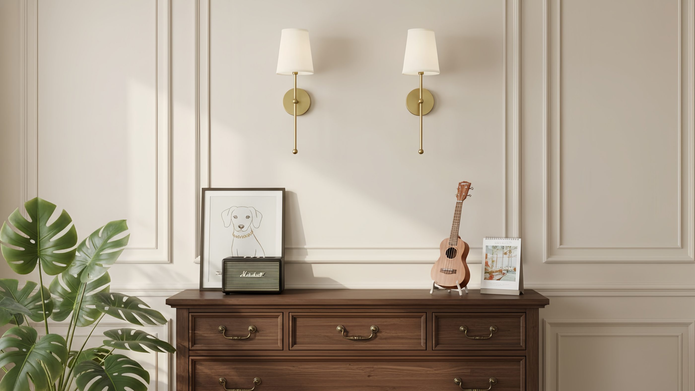 Two gold wall lamps styled above a console