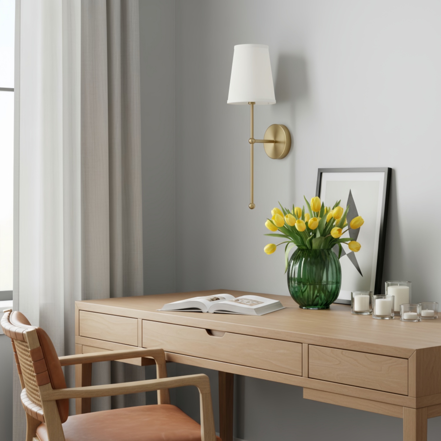 Gold wall lamp beside a vanity table with flowers