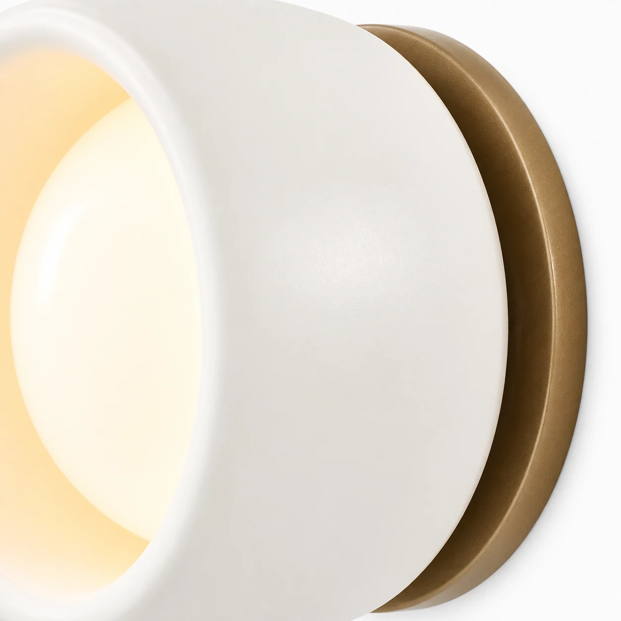 Close-up detail of Cerova ivory porcelain shade and bronze finish
