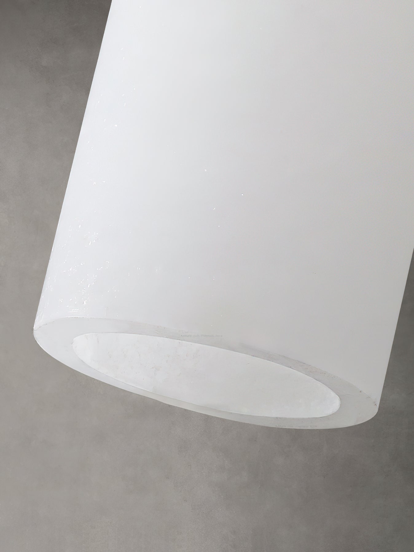 Close view of the white alabaster cylindrical shade edge