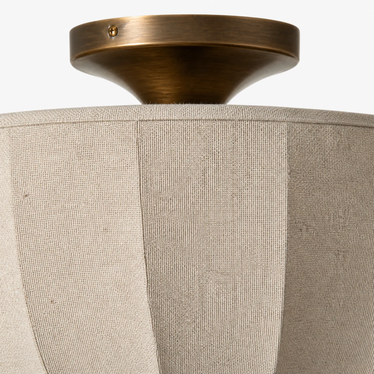 Close view of the Loomis linen shade texture and aged brass detail
