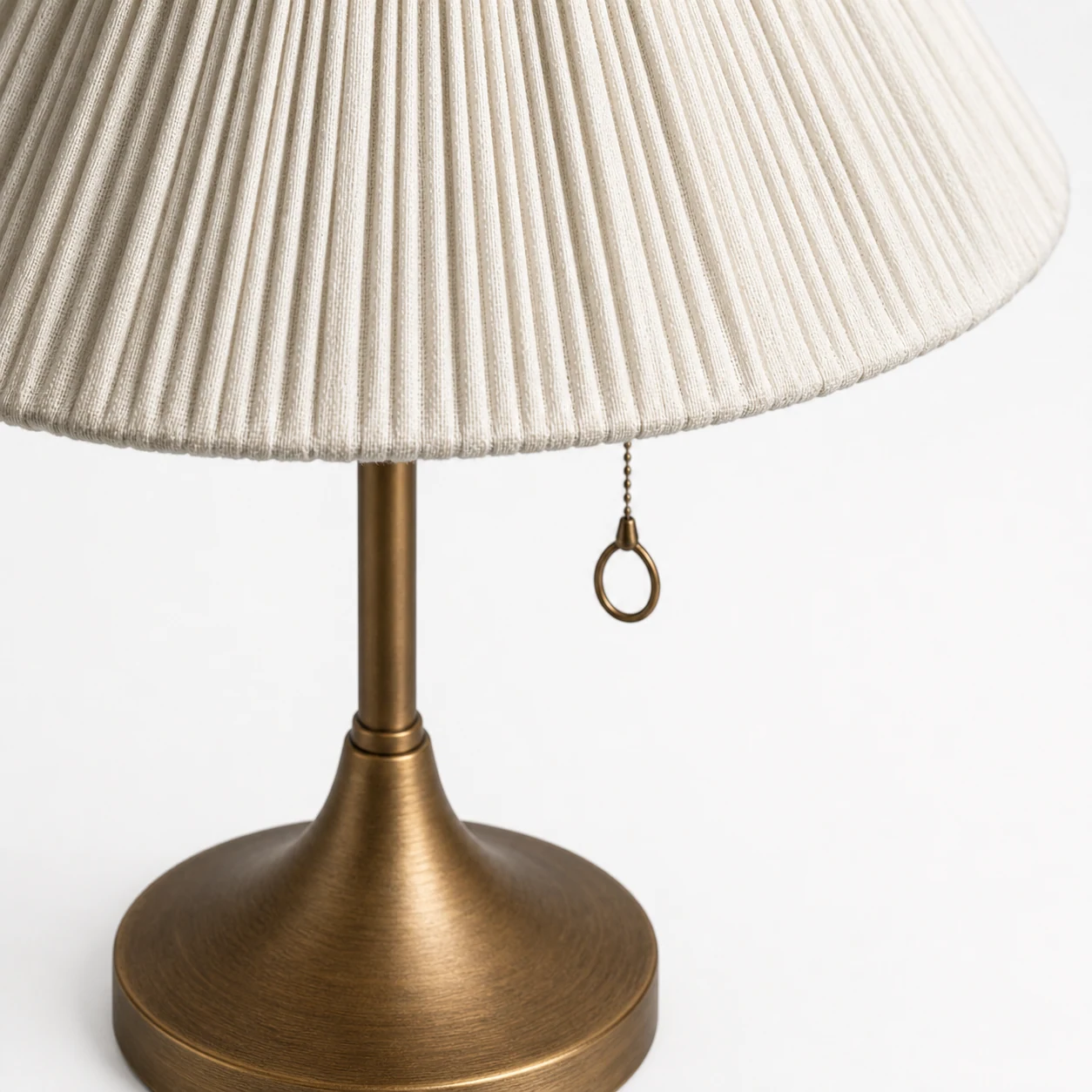 Close-up of Nordlys linen shade texture and vintage brass detail