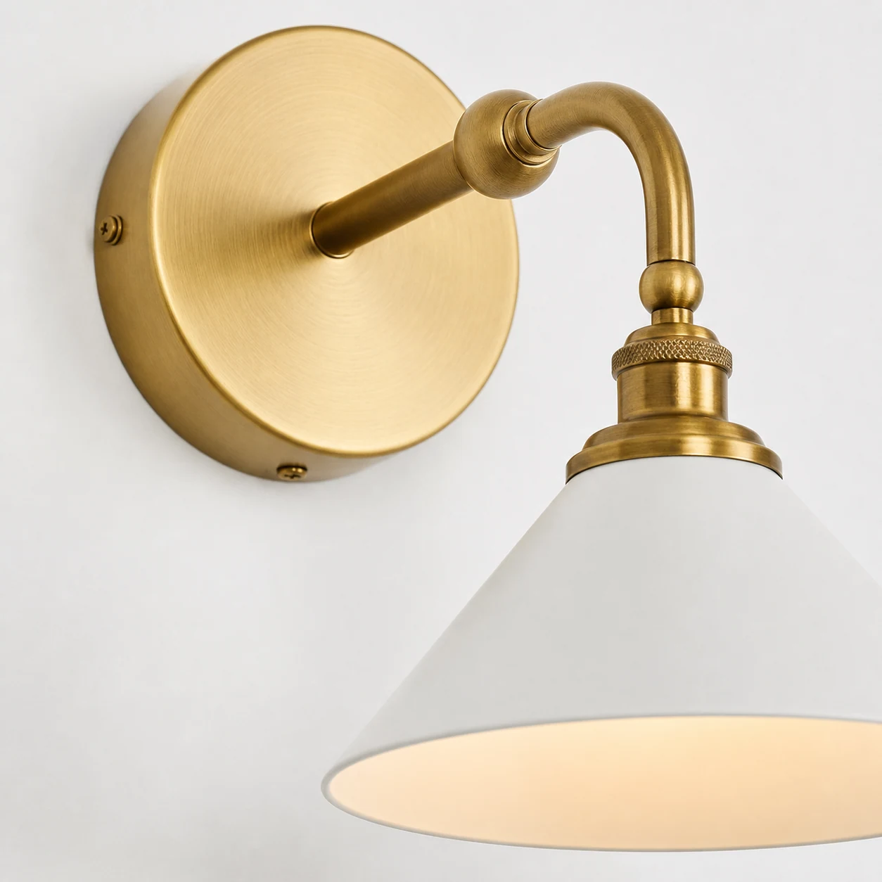 Close-up detail of the Thetford cone shade wall sconce finish and construction