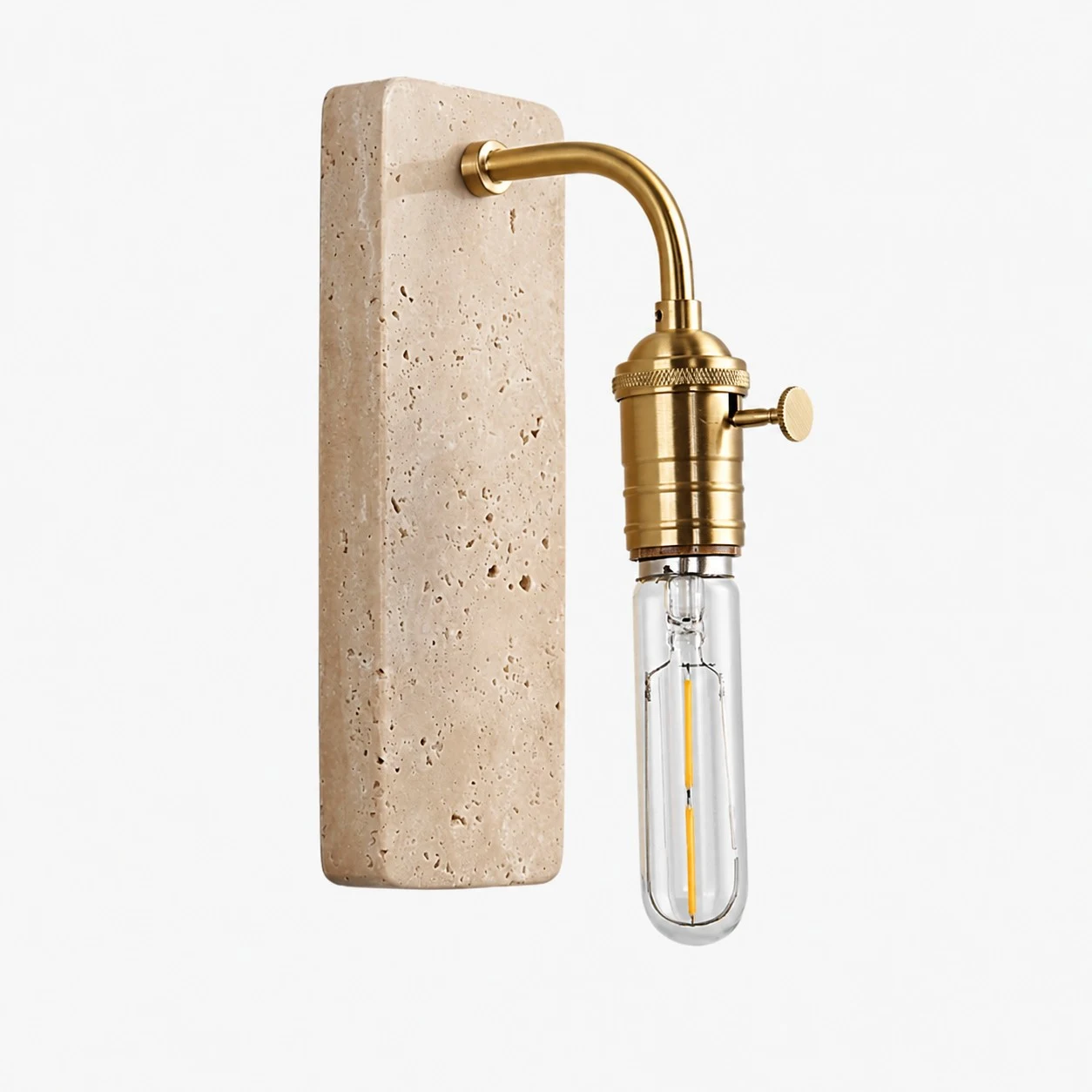 Gold travertine wall sconce on a clean background