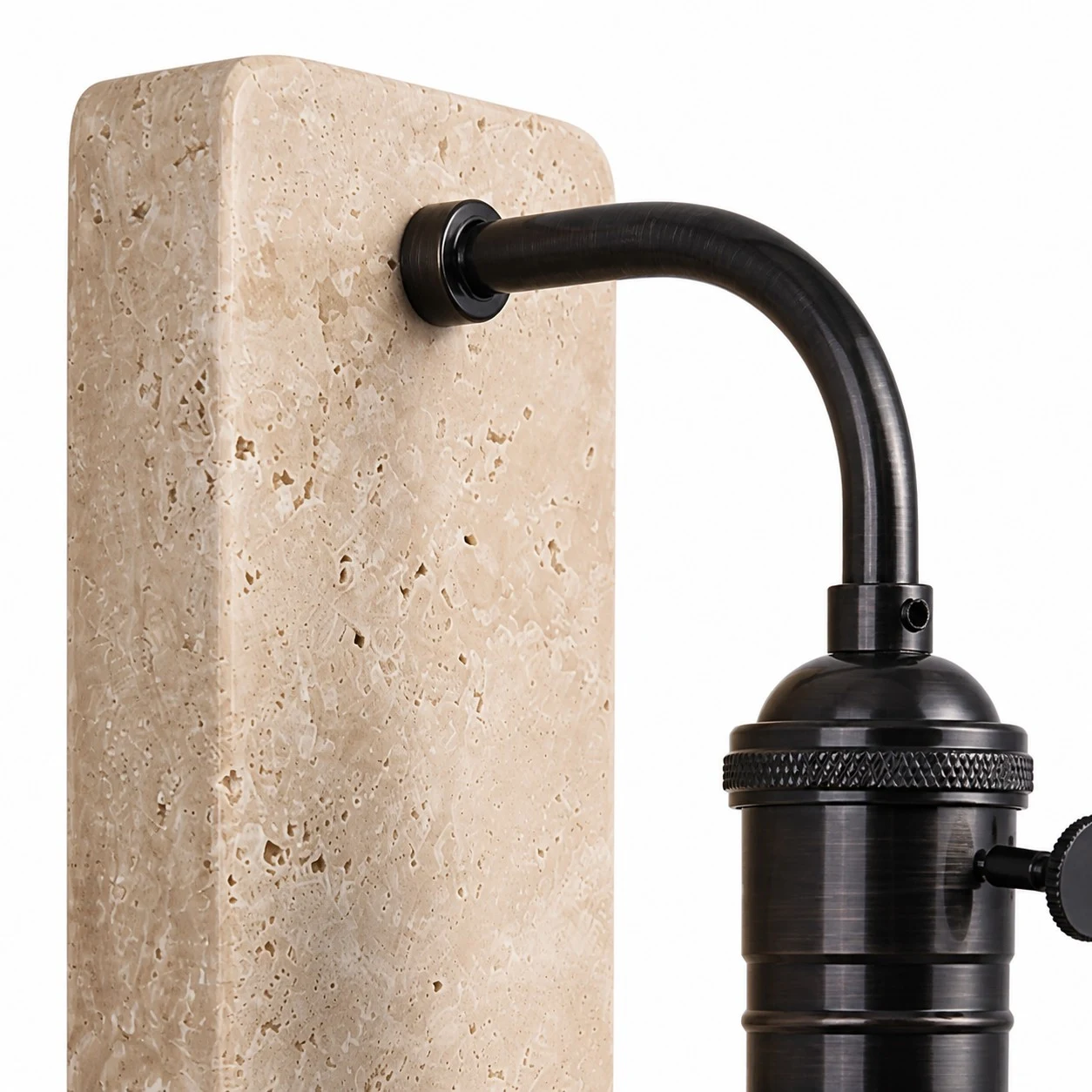 Travertine and black brass arm connection detail