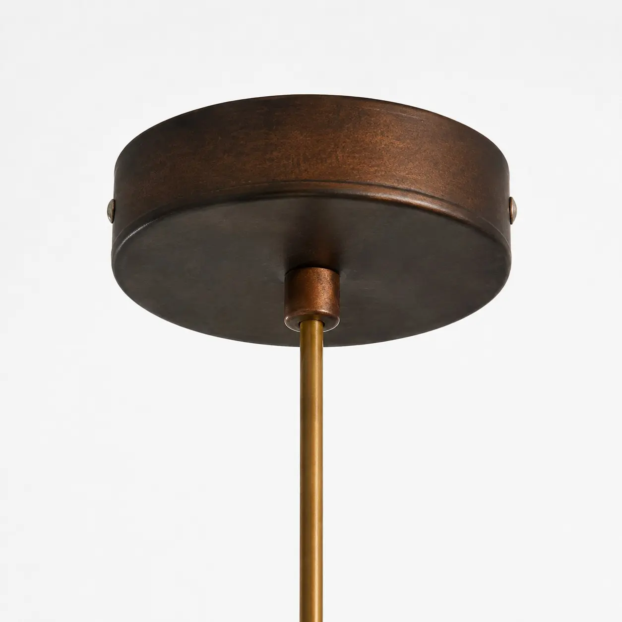 Close view of the ceiling canopy and suspension rod